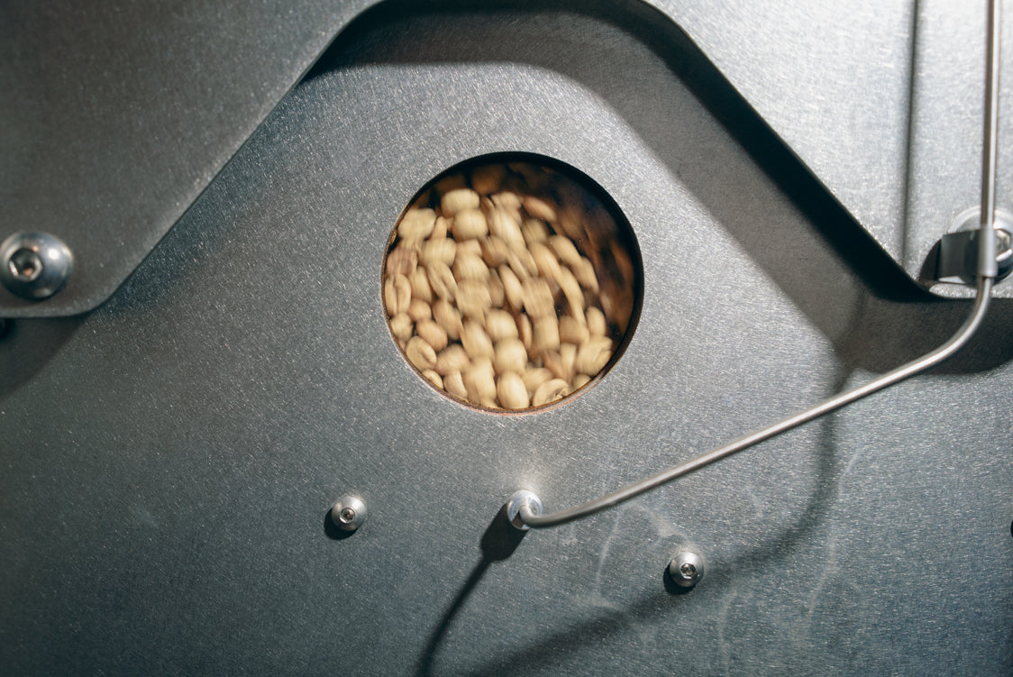 Green coffee in the roaster hopper at the HoneyCo roastery