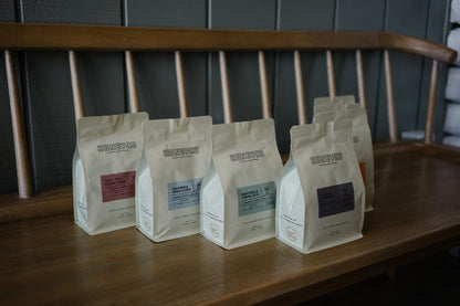 HoneyCo bags lined up across the bench