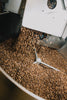Freshly roasted coffee dropping into the cooling tray