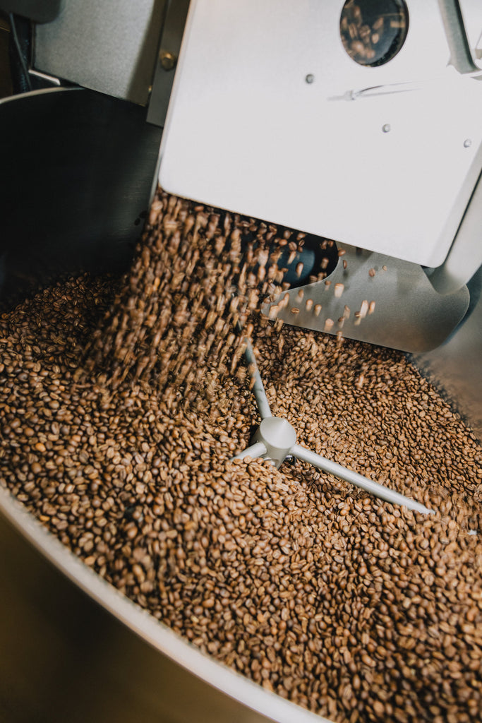 Freshly roasted coffee dropping into the cooling tray