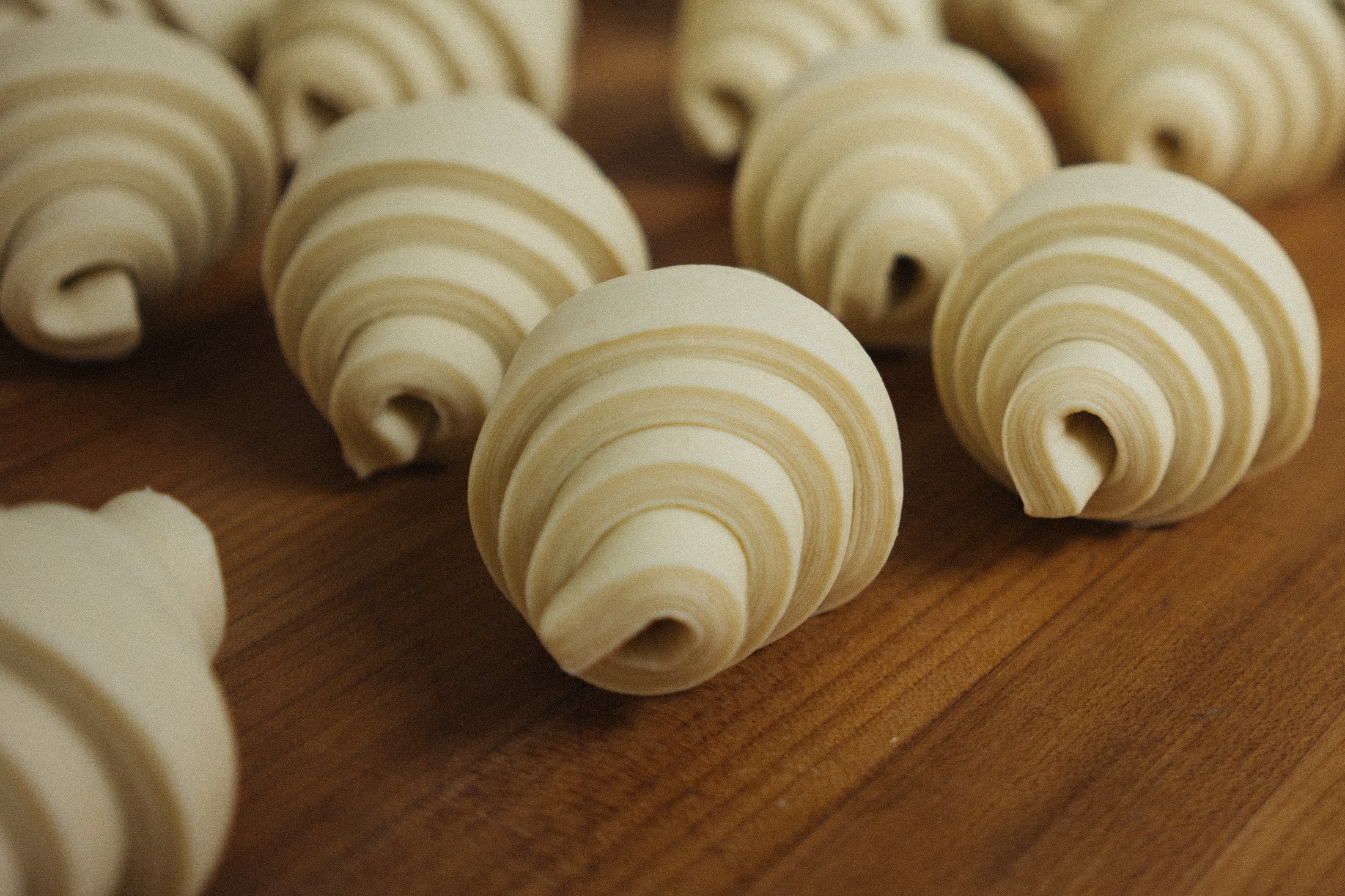 Butter croissants rolled and waiting to prove