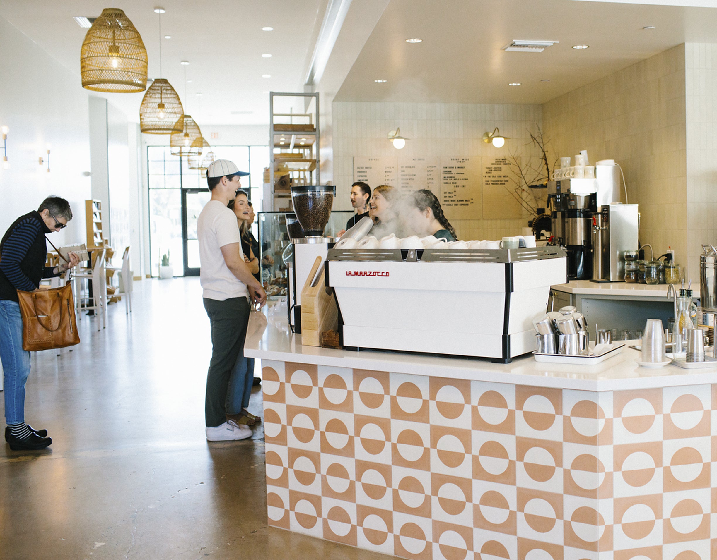 Baristas and customers at the espresso bar in the Morro Bay cafe